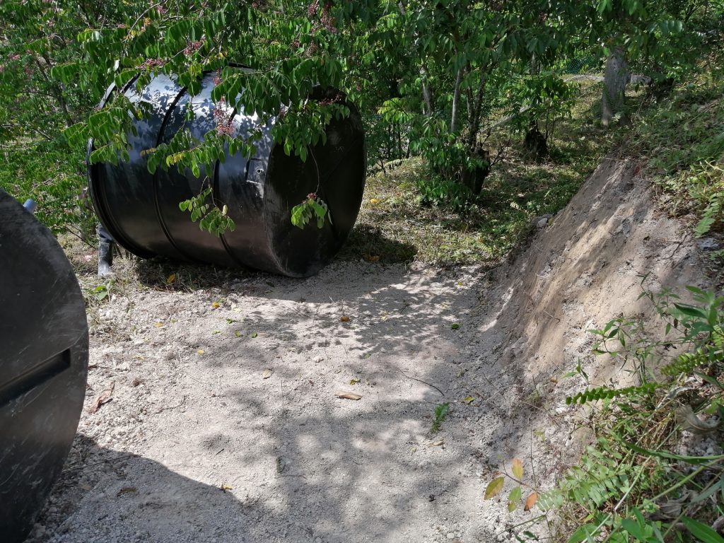 The ground is properly levelled and compacted while the protruding slope face is carved a little to ensure a snug fit into the terrace.