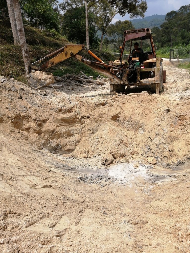Initial stage of digging. Freshly seen here puncturing the water table.